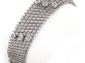 18739 -  A 14 karat white gold mesh style bracelet with round brilliant cut diamonds totaling 0.57 carats.