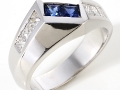10451 -  A 14 karat white gold ring with sapphires totaling 0.50 carats and princess cut diamonds totaling 0.70 carats.