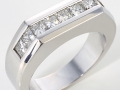 12781 -  A 14 karat white gold band with princess cut diamonds totaling  1.50 carats.