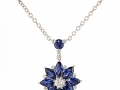 13875 -  An 18 karat white gold pendant with round brilliant cut diamonds totaling 0.24 carats and marquise cut sapphires totaling 2.48 carats.