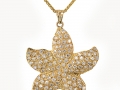 18367 - A 14 karat yellow gold starfish pendant with round brilliant cut diamonds totaling 2.00 carats.