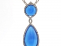 19117 - A 14 karat white gold blue agate pendant with round brilliant cut diamonds totalling 0.74 carats.