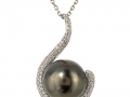 19143 - A 18 karat white gold tahitian pearl pendant with pave set round brilliant cut diamonds totaling 0.53 carats.