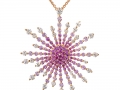 19206 - An 18 karat rose gold starburst pendant with pink sapphires totaling 1.65 carats and round brilliant cut diamonds totaling 1.16 carats.
