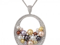 20200 - An 18 karat white gold pendant set with multi-colored pearls and round brilliant cut diamonds totaling 4.33 carats.
