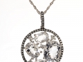 20381 - A 14 karat white gold pendant with white quartz and 0.19 carats of white sapphires and 0.17 carats of diamonds.