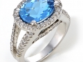 13236 - A 14 karat white gold ring with a 4.50 carat blue topaz and round brilliant cut diamonds totaling 0.74 carats.