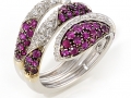 13320 - An 18 karat white gold snake ring with rubies totaling 1.21 carats and 0.72 carats of round brilliant cut diamonds.