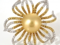 18286 - An 18 karat white gold ring with a golden south sea pearl, yellow and white round brilliant cut diamonds totaling 1.94 carats.