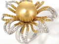 18286 - An 18 karat white gold ring with a golden south sea pearl, yellow and white round brilliant cut diamonds totaling 1.94 carats.
