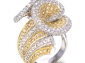 18604 - An 18 karat white and yellow gold ring with yellow and white round brilliant cut diamonds totaling 5.19 carats. (2)