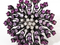 19114 - An 18 karat white gold flower ring set with round brilliant cut pink sapphires totaling 3.57 carats and round brilliant cut diamonds totaling 0.21 carats.