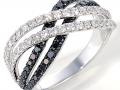 19122 - An 18 karat white gold band with black and white round brilliant cut diamonds totaling 0.98 carats.