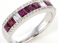 19135 - An 18 karat white gold band with rubies totaling 0.83 carats, baguette and round brilliant cut diamonds totaling 0.31 carats.