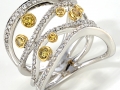 19196 - An 18 karat white gold ring with yellow and white round brilliant cut diamonds totaling 0.83 carats.
