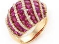 19694 - An 18 karat rose gold ring set with round brilliant cut rubies and diamonds totaling 4.83 carats.