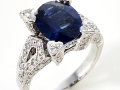 19746 - An 18 karat white gold ring set with an oval brilliant cut sapphire weighing 2.25 carats and round brilliant cut diamonds totaling 0.75 carats.