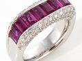 20338 - An 18 karat white gold band with round brilliant cut diamonds totaling 0.87 carats and baguette cut rubies.
