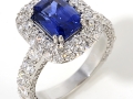 20348 - An 18 karat white gold ring set with an emerald cut sapphire weighing 2.01 carats and round brilliant cut diamonds totaling 2.25 carats.