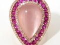 20395 - A 14 karat rose gold ring with a 7.16 carat rose quartz, round brilliant cut pink sapphires and diamonds totaling 2.07 carats.