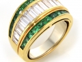 20400 - An 18 karat yellow gold ring set with baguette cut diamonds totaling 1.33 carats and square cut emeralds.