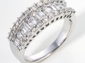 19211 - An 18 karat white gold band with baguette and round brilliant cut diamonds totaling 0.95 carats.